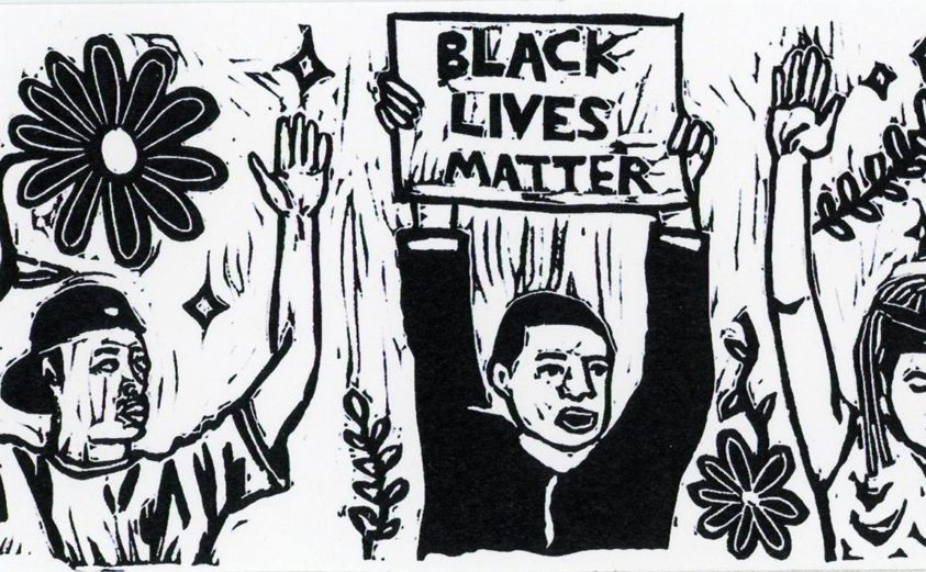Three people with their hands up; one is holding a sign that says black lives matter