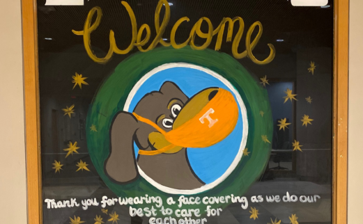 Painted image of Smokey wearing a mask that reads "Libraries Welcome, thank you for wearing a face covering"