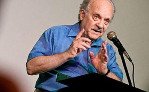 Photograph of David Madden speaking from a podium