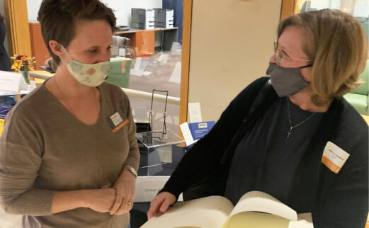 Amanda Richards and Dr. Karen Lasater examine the special bound edition.