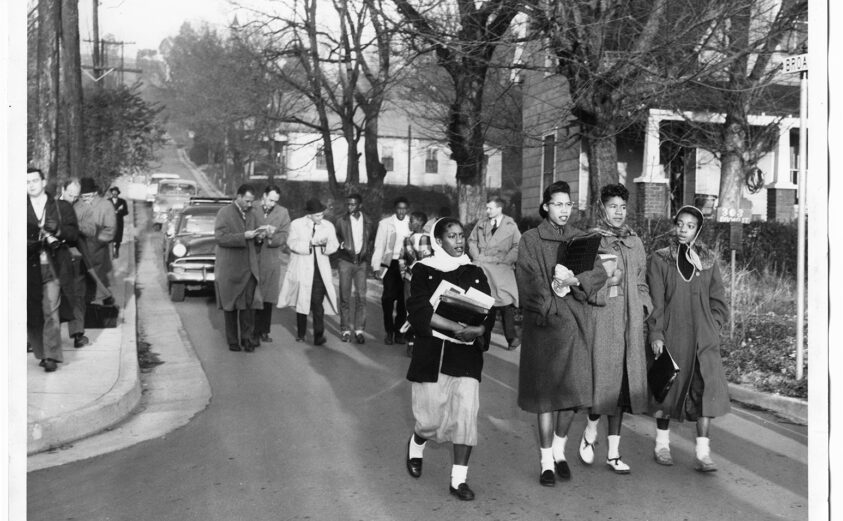 Photo: A group of Black students being escorted to the newly integrated Clinton High School, 1956