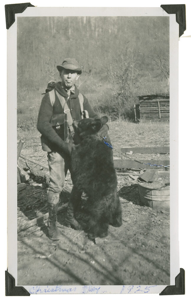 Dutch Roth (and friend) at Fish Camp near Elkmont. The “friend” is a bear cub who is standing with his paws against Roth’s chest. From Tales from the Woods digital collection, UT Libraries.